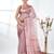 nude pink organza saree with floral motifs and blue border