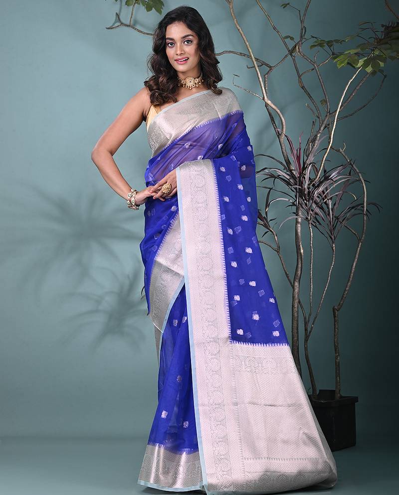 blue organza saree with floral motifs and sea green border