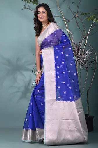 blue organza saree with floral motifs and sea green border
