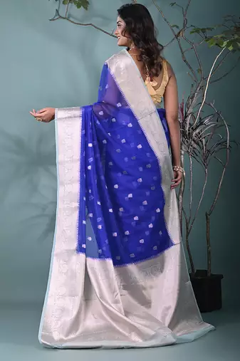 blue organza saree with floral motifs and sea green border