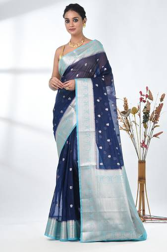 navy blue organza saree with floral motifs and light blue border