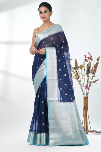 navy blue organza saree with floral motifs and light blue border