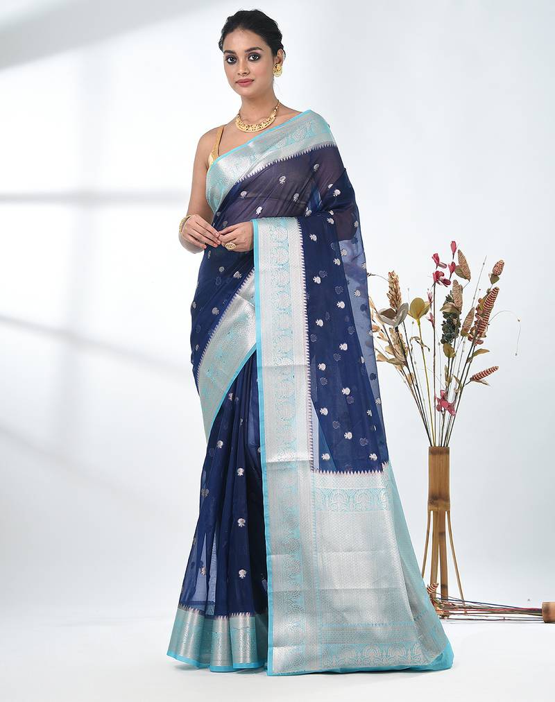 navy blue organza saree with floral motifs and light blue border