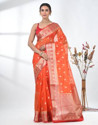 orange organza saree with floral motifs and sea green border 1