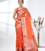 orange organza saree with floral motifs and sea green border