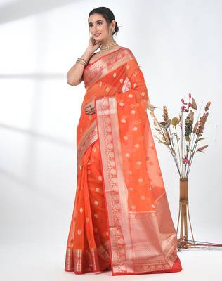 orange organza saree with floral motifs and sea green border 2