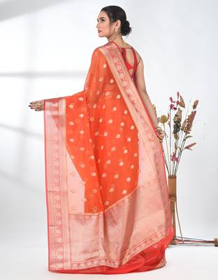 orange organza saree with floral motifs and sea green border 3