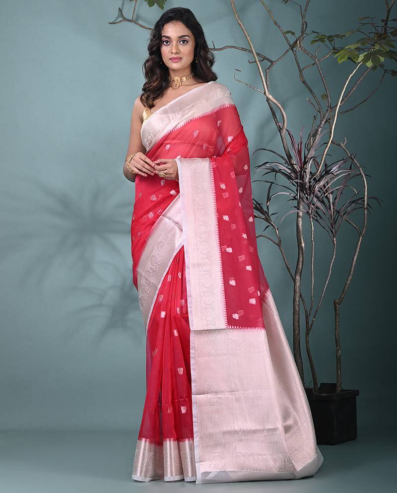 fuchsia organza saree with floral motifs and sea green border