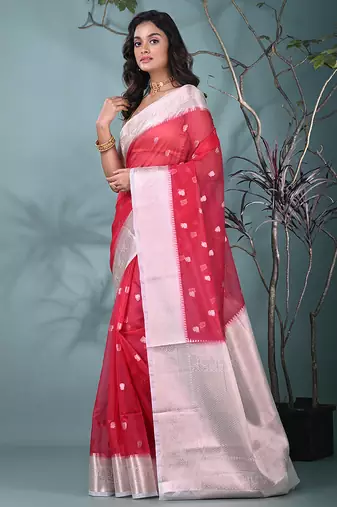 fuchsia organza saree with floral motifs and sea green border