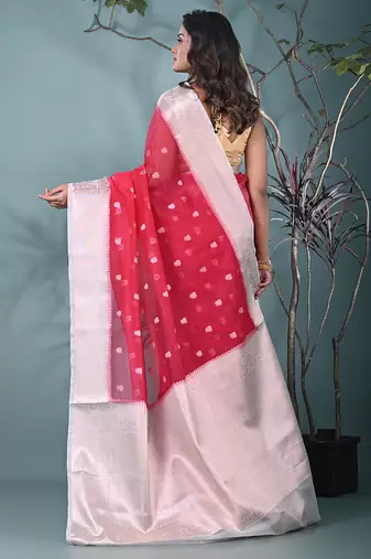 fuchsia organza saree with floral motifs and sea green border