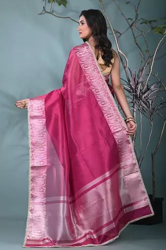 fuchsia tissue saree with intricate silver zari border