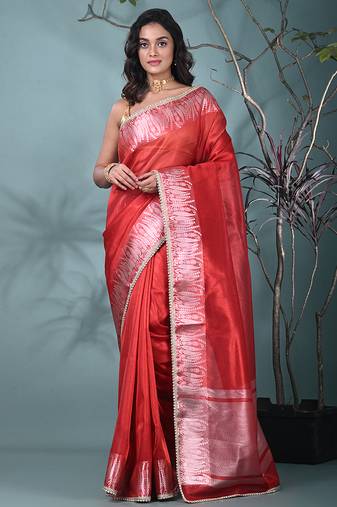 red tissue saree with intricate silver zari border