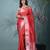 red tissue saree with intricate silver zari border