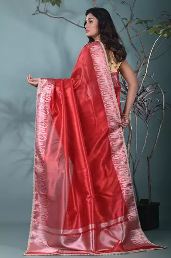 red tissue saree with intricate silver zari border