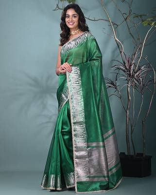 green tissue saree with intricate silver zari border 2