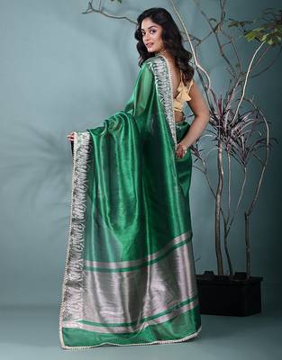 green tissue saree with intricate silver zari border 3