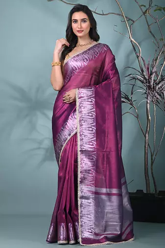 purple tissue saree with intricate silver zari border