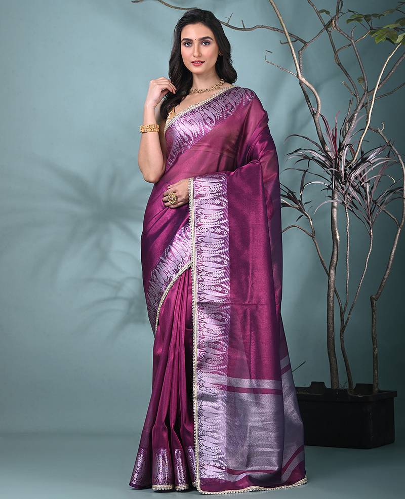 purple tissue saree with intricate silver zari border