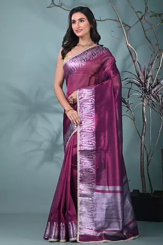 purple tissue saree with intricate silver zari border