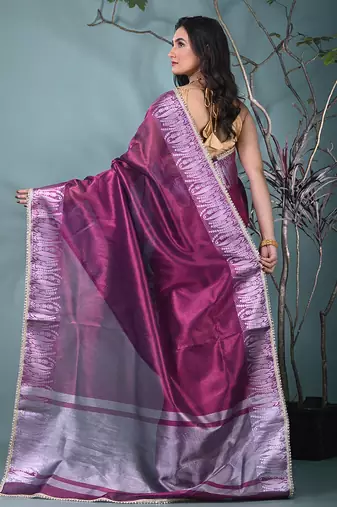purple tissue saree with intricate silver zari border