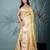 yellow tissue saree with intricate silver zari border