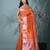 orange tissue saree with intricate silver zari border