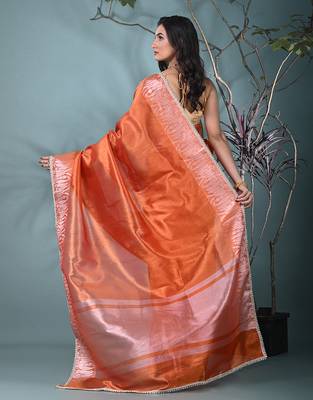 orange tissue saree with intricate silver zari border 3