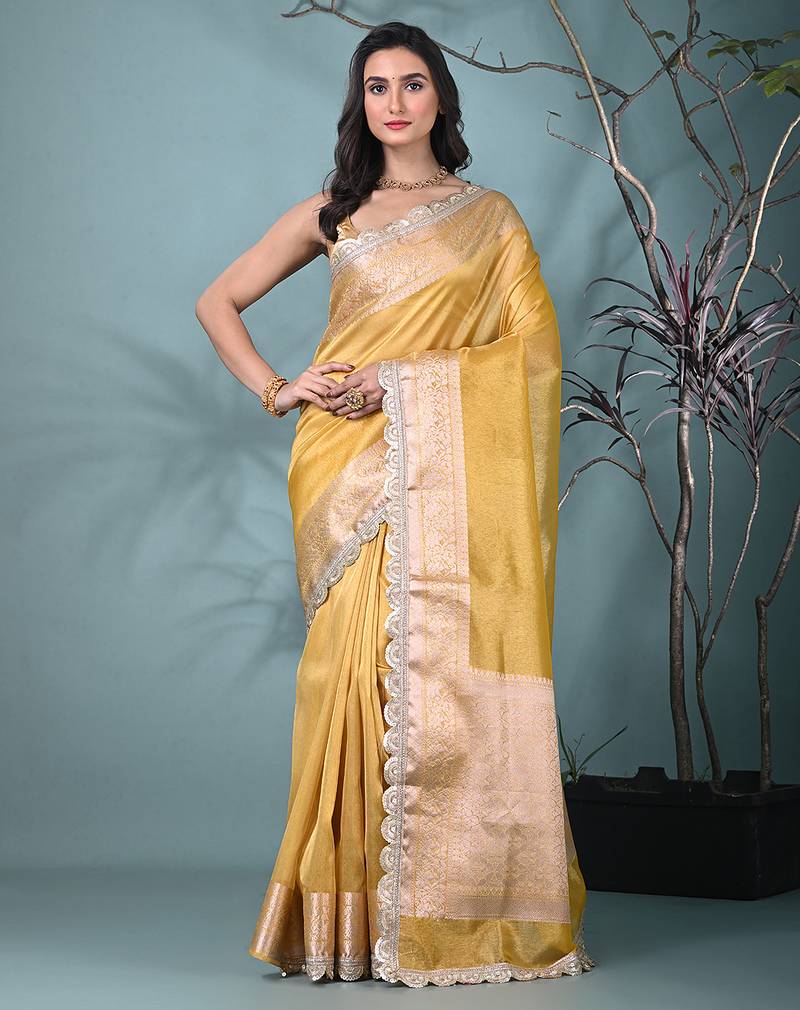 yellow tissue saree with gotapatti detailing and elegant border