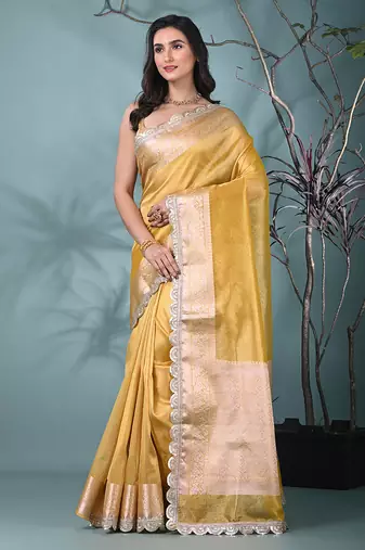 yellow tissue saree with gotapatti detailing and elegant border