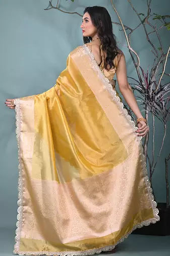 yellow tissue saree with gotapatti detailing and elegant border