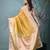 yellow tissue saree with gotapatti detailing and elegant border