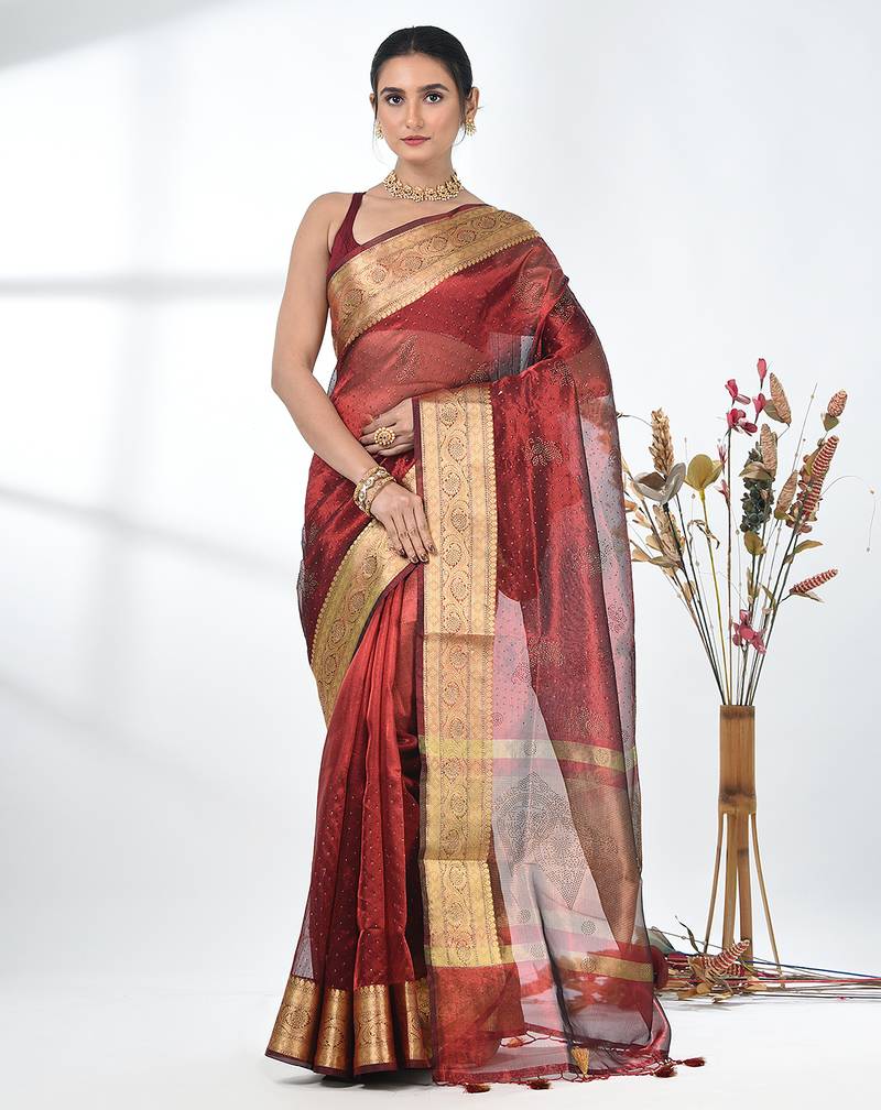 dark red tissue saree with stone detailing