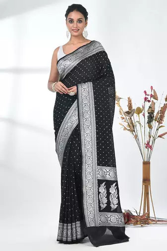 black georgette saree with silver border and detailing