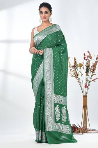 green georgette saree with silver border and detailing