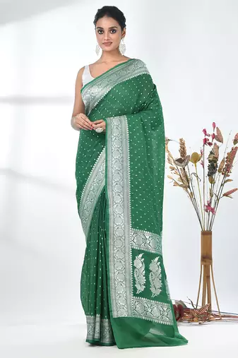 green georgette saree with silver border and detailing