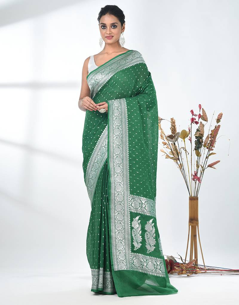 green georgette saree with silver border and detailing
