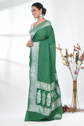 green georgette saree with silver border and detailing