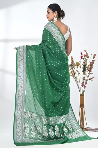 green georgette saree with silver border and detailing