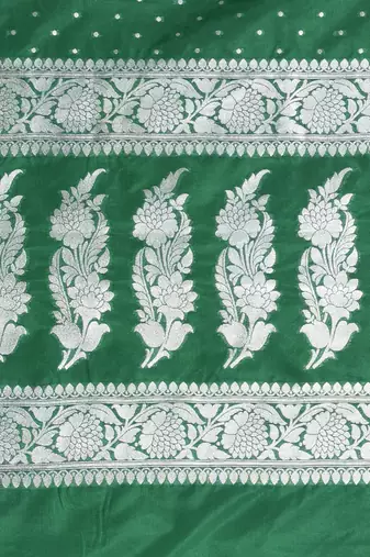 green georgette saree with silver border and detailing