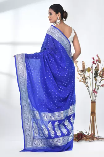 blue georgette saree with silver border and detailing