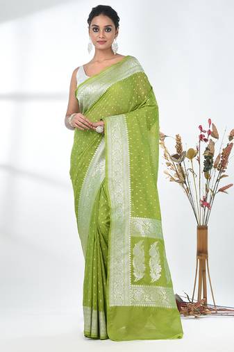 green georgette saree with silver border and detailing