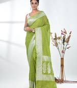 green georgette saree with silver border and detailing