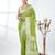green georgette saree with silver border and detailing