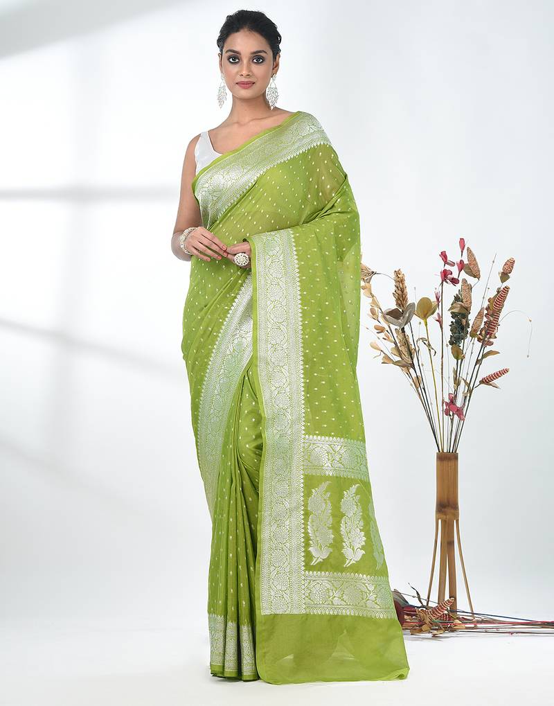 green georgette saree with silver border and detailing