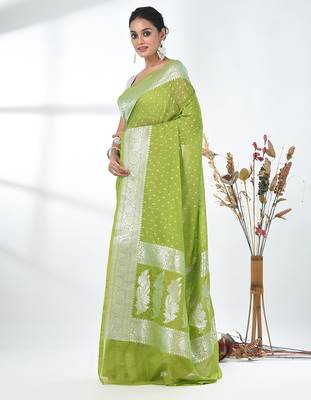 green georgette saree with silver border and detailing 2