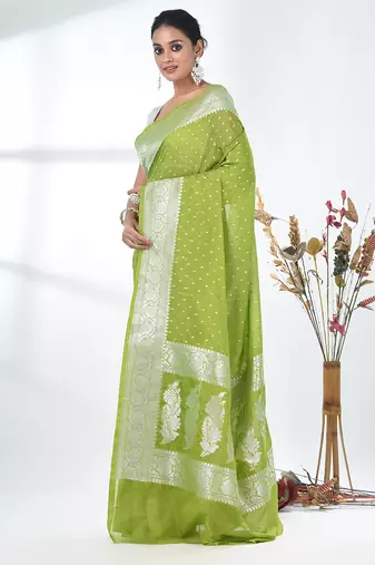 green georgette saree with silver border and detailing