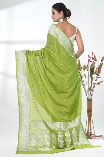 green georgette saree with silver border and detailing