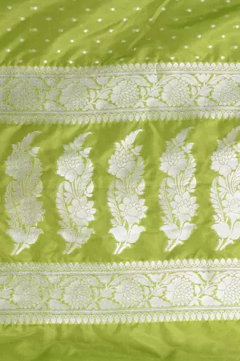 green georgette saree with silver border and detailing