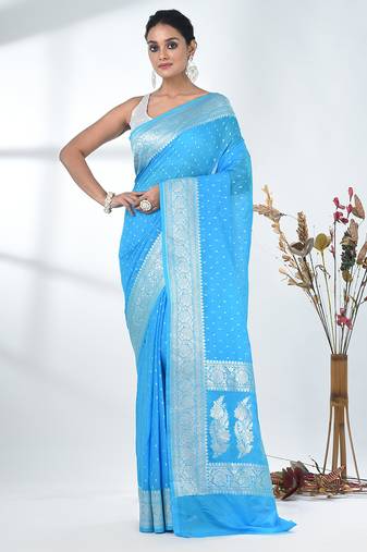 sky blue georgette saree with silver border and detailing