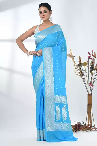 sky blue georgette saree with silver border and detailing